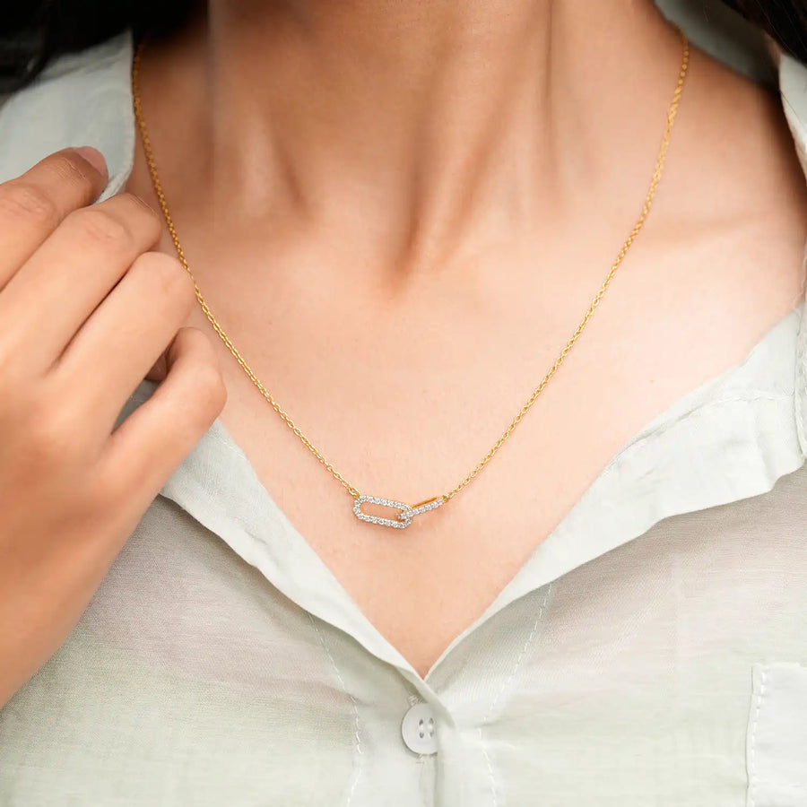 Model wearing interlocking loop diamond pendant