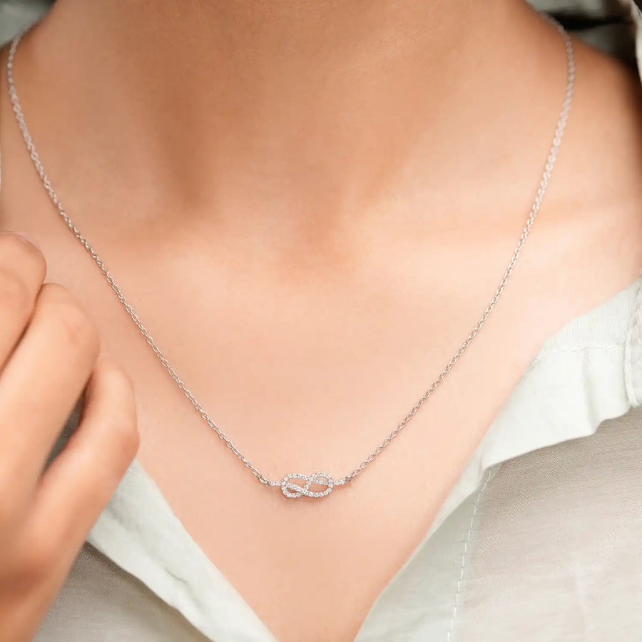 Model wearing heart infinity gemstone pendant