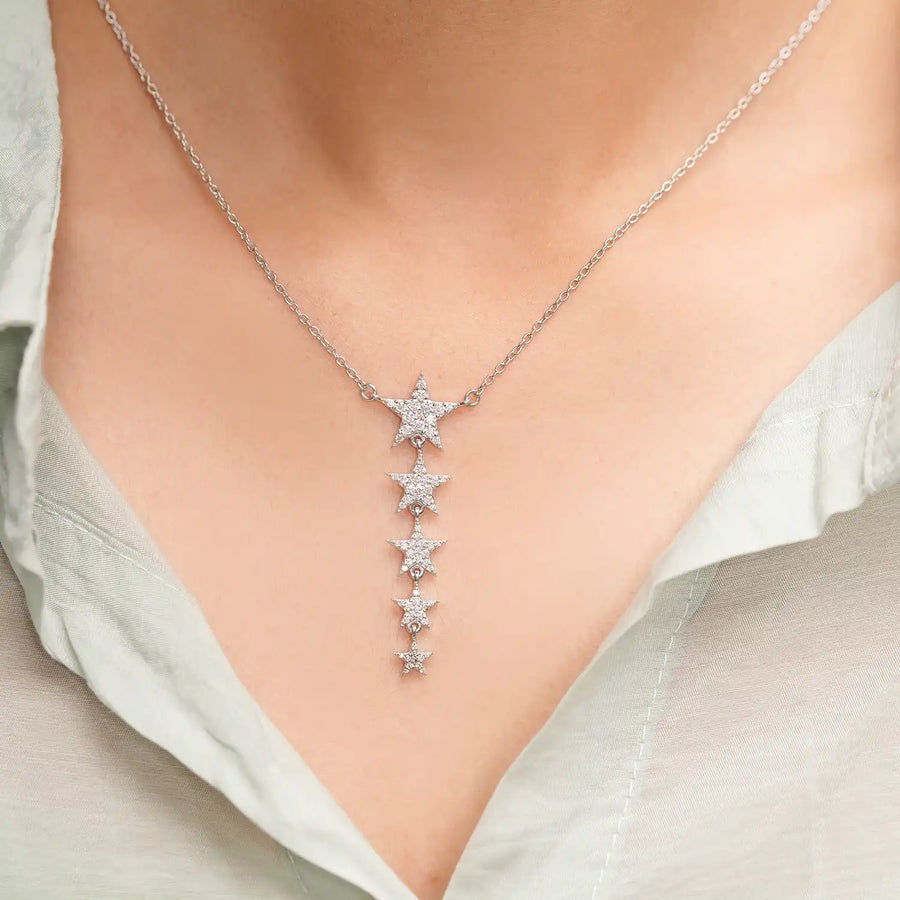 Model wearing five-star cascade diamond pendant