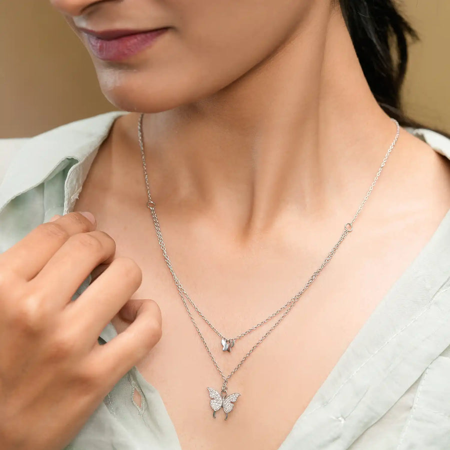 Close-up on neckline showing layered motifs
