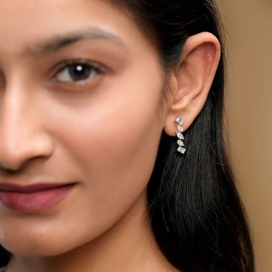 Model wearing cascade diamond earrings