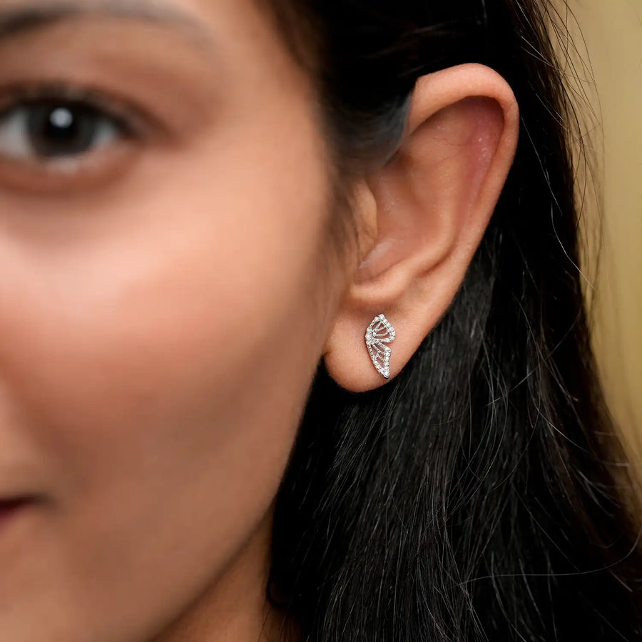 Model wearing butterfly lattice earrings
