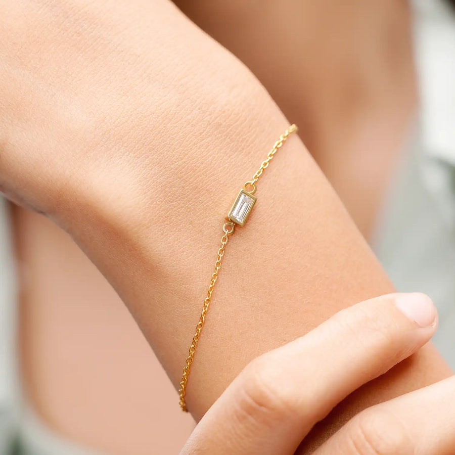 Model wearing baguette gemstone bracelet