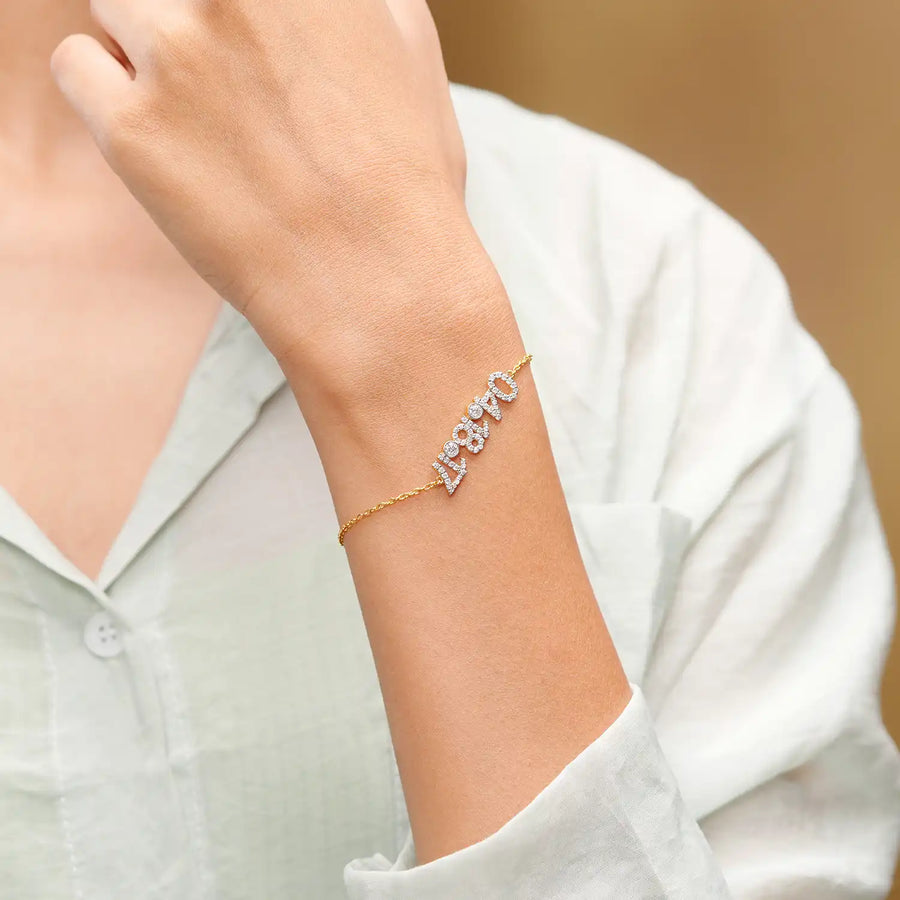 Close-up wrist shot highlighting chain and digits