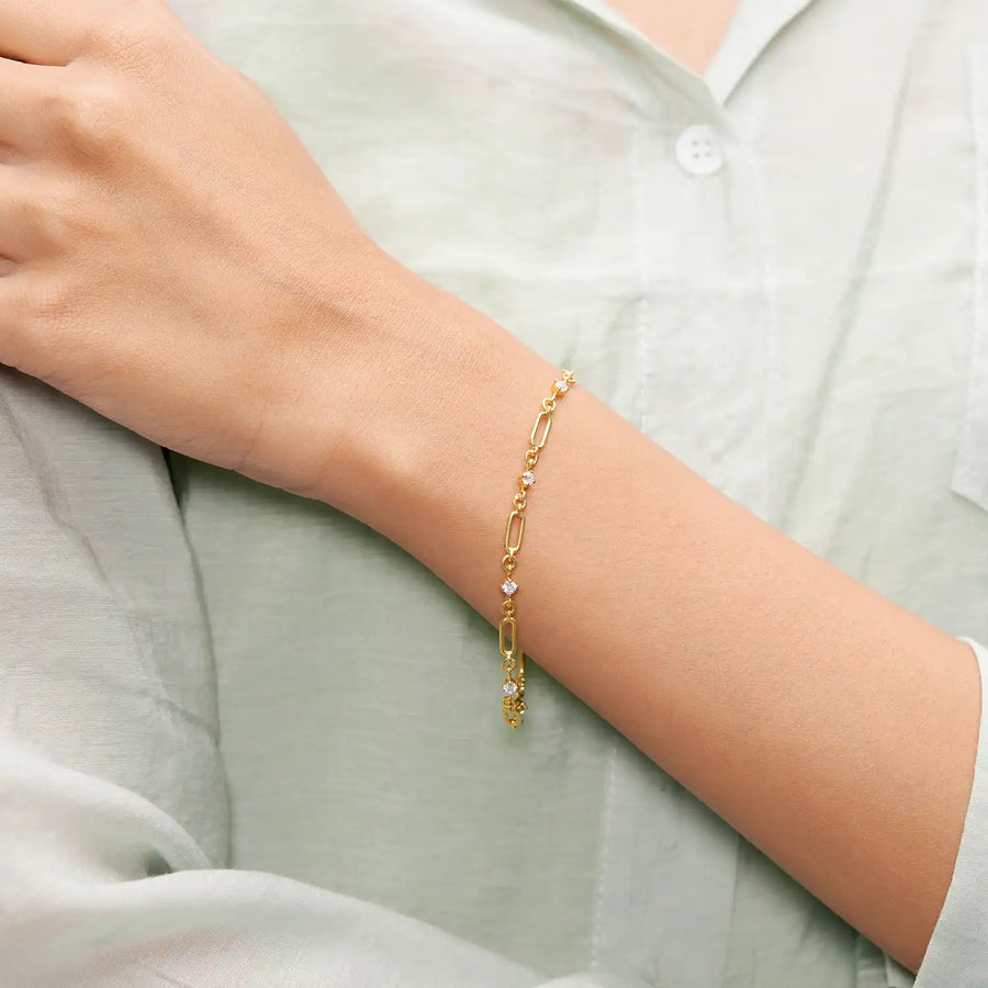 Model wearing gold diamond link bracelet