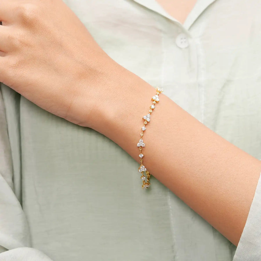 Model wearing floral diamond cluster bracelet