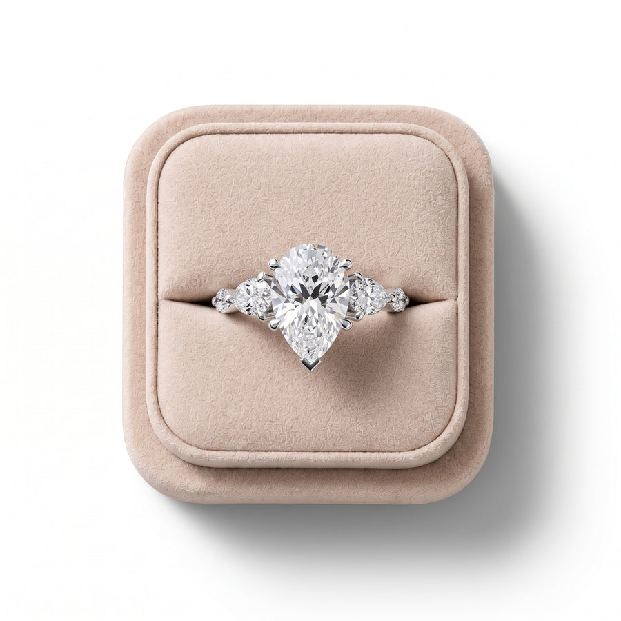 3.82 Ct Pear Three-Stone Lab Grown Diamond With Side Stone Ring