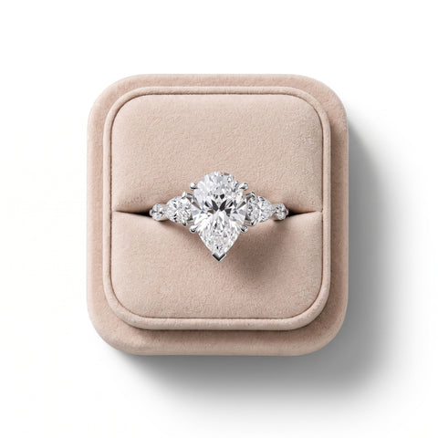 3.82 Ct Pear Three-Stone Lab Grown Diamond With Side Stone Ring