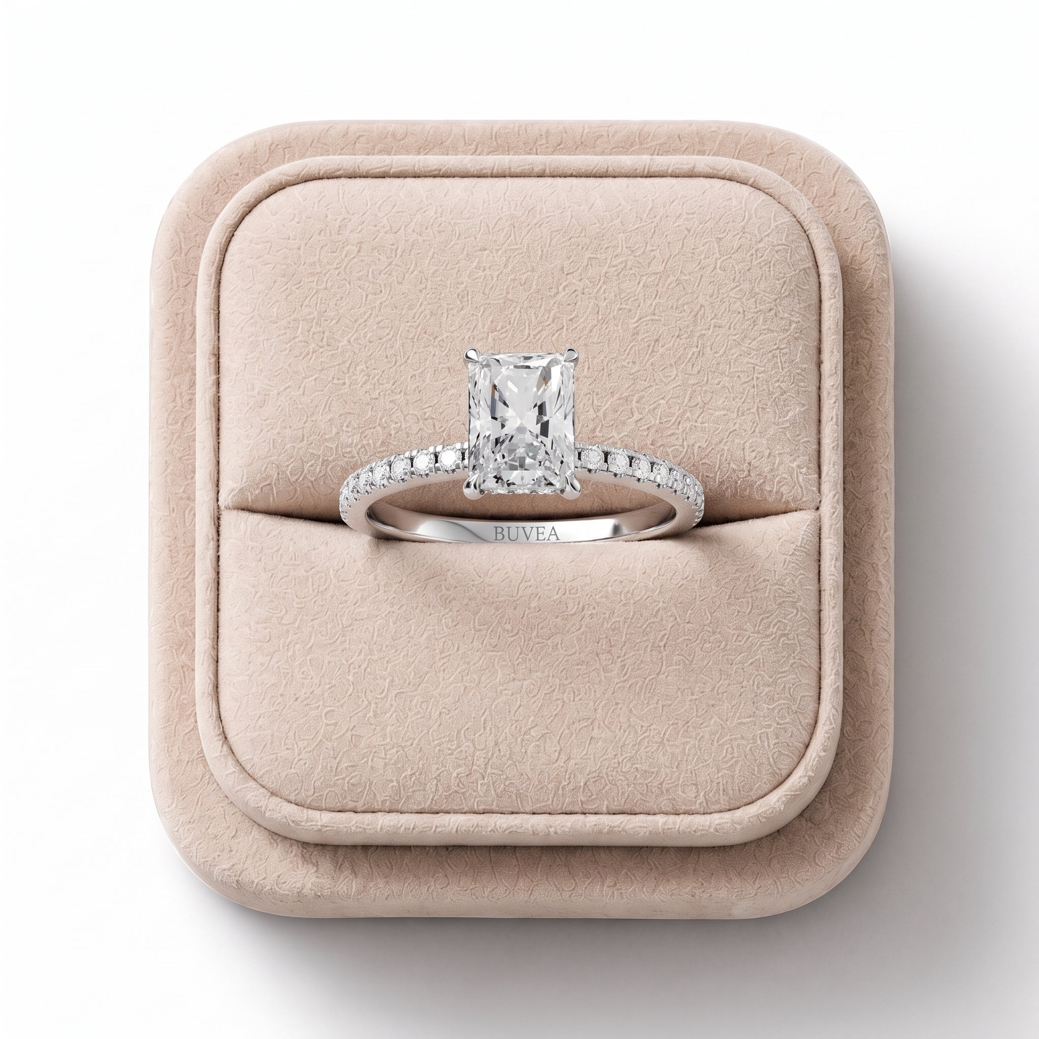 Radiant 1.20 Ct lab diamond ring with a four-prong setting, accented by round diamonds on an 18K gold band.