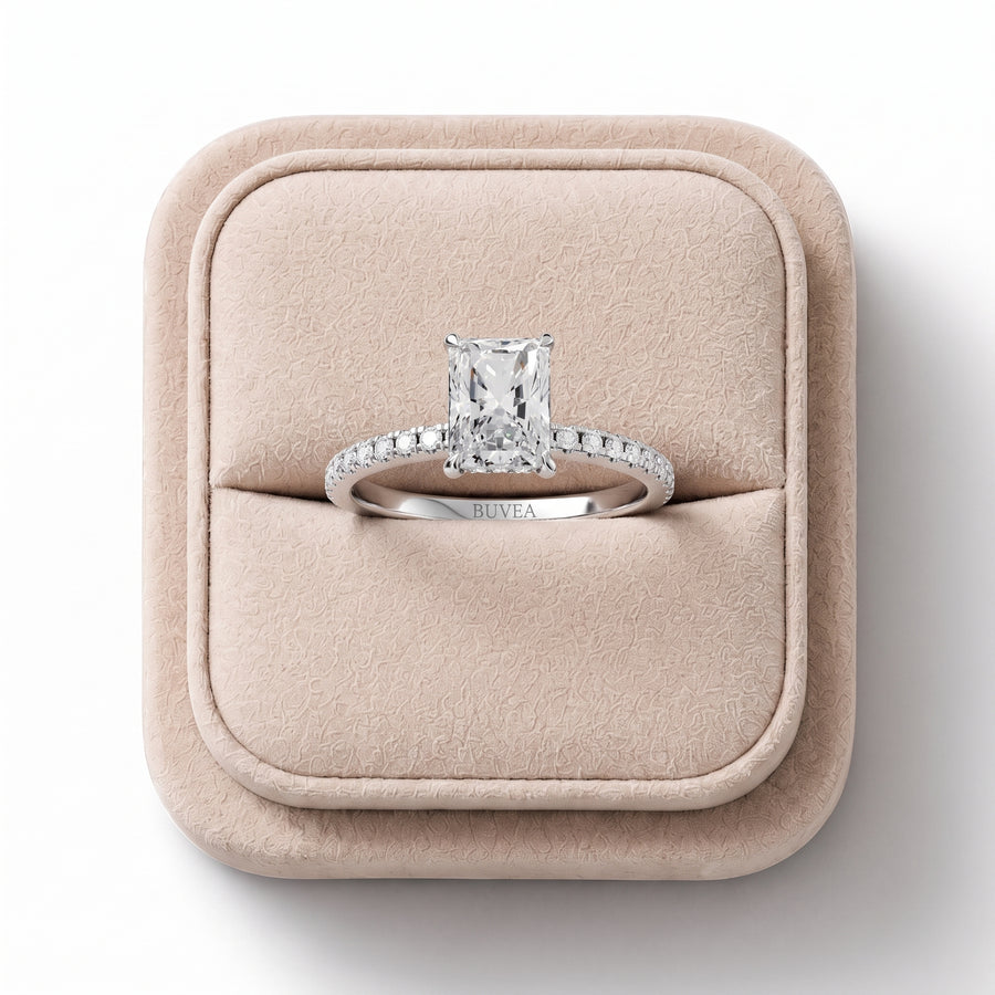 Radiant 1.20 Ct lab diamond ring with a four-prong setting, accented by round diamonds on an 18K gold band.