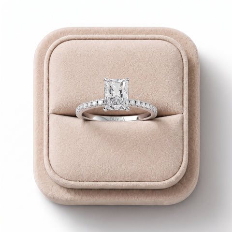 Radiant 1.20 Ct lab diamond ring with a four-prong setting, accented by round diamonds on an 18K gold band.