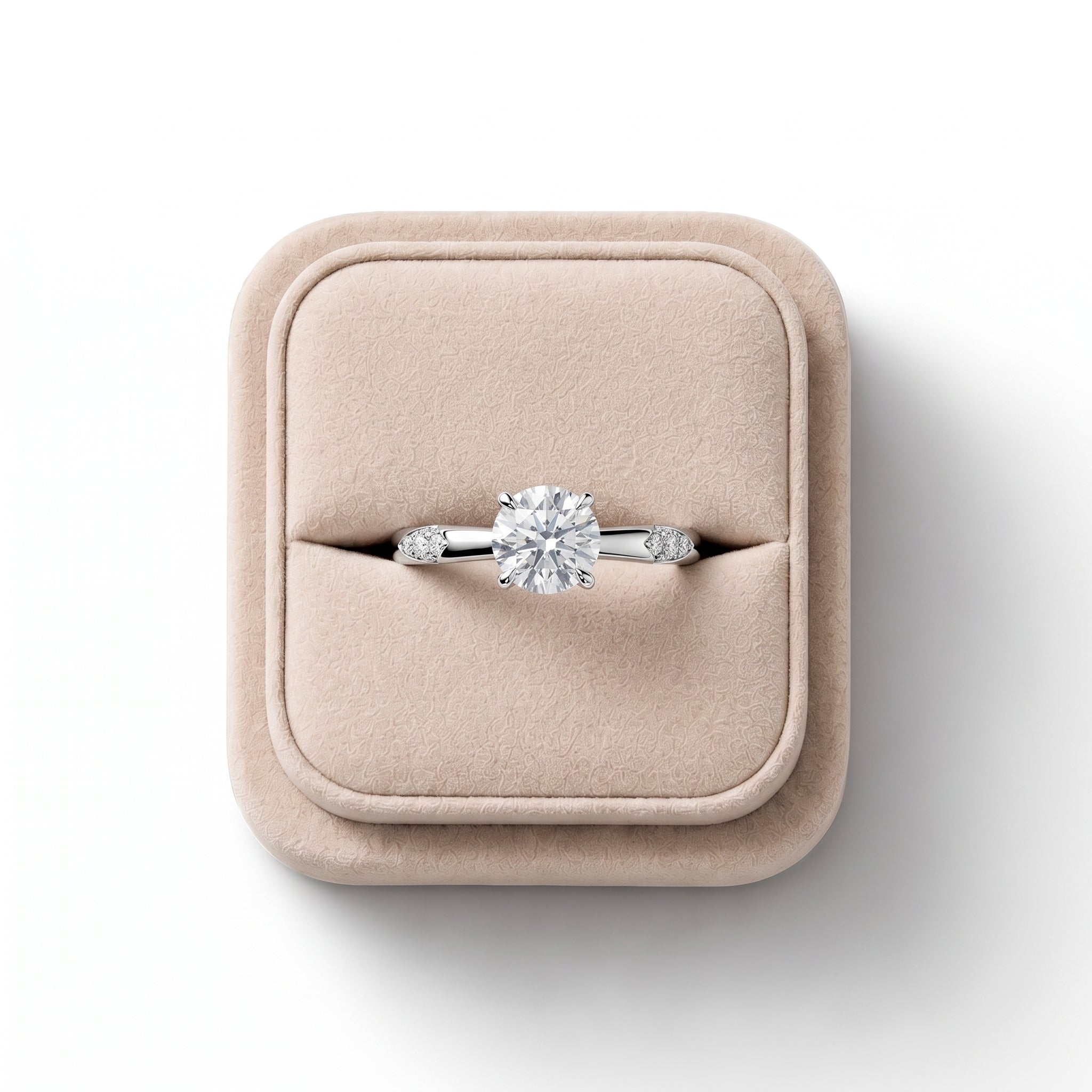 Round solitaire ring featuring a 1 CT lab-grown diamond in a four-prong setting with three accent diamonds on either side.