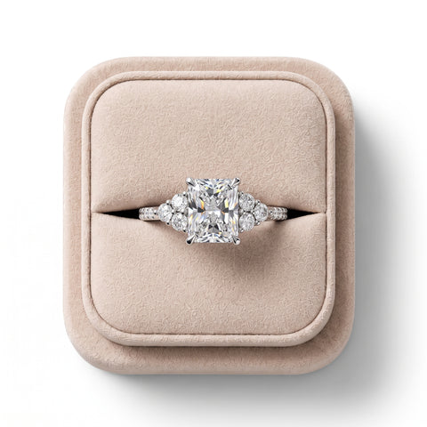Radiant 1.5 CT lab grown diamond center ring in 18K gold, featuring round diamond halo and accent stones on the shoulders.