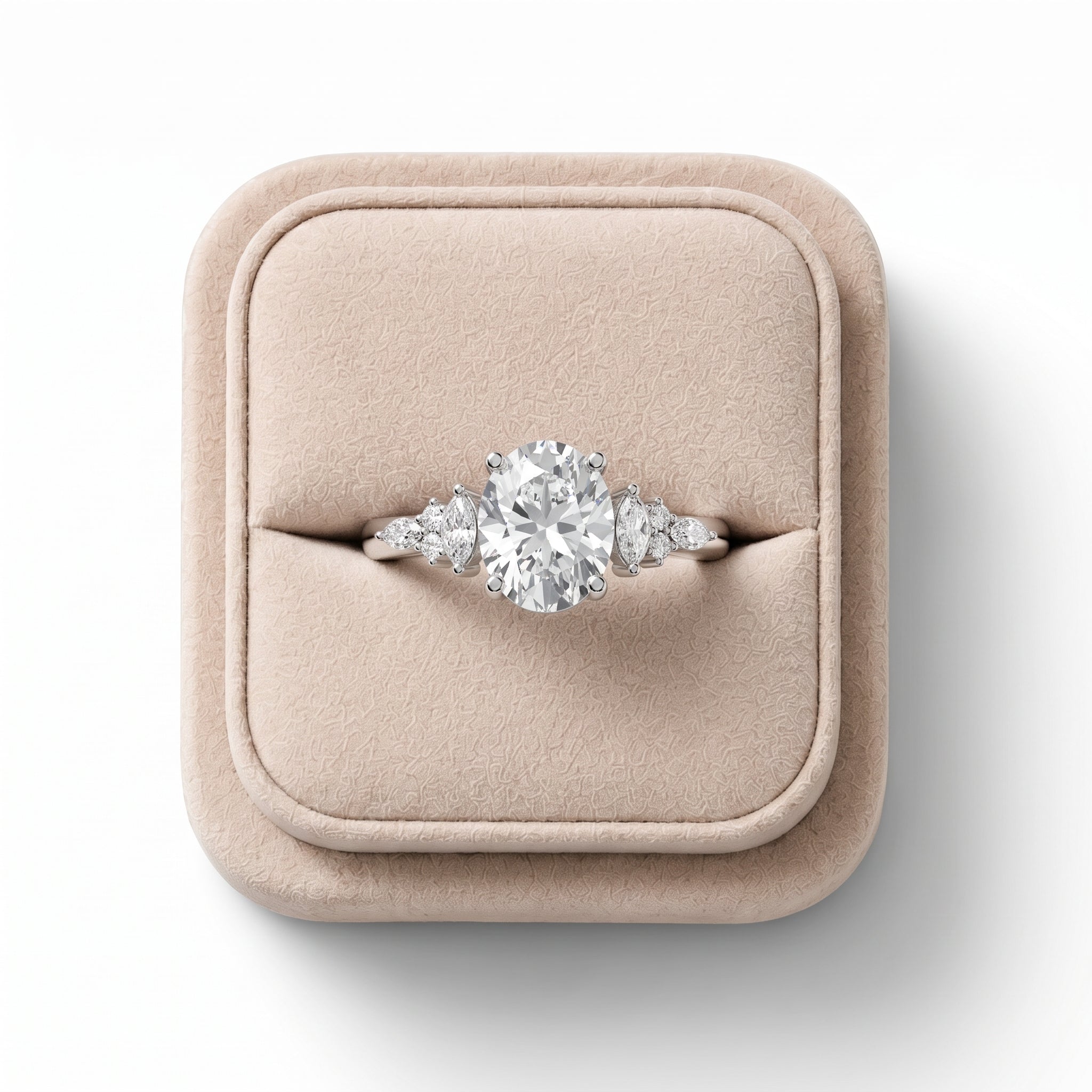 1.67 Ct oval solitaire ring featuring a 1.5 Ct center diamond with marquise side stones and round accents, set in 18K gold.