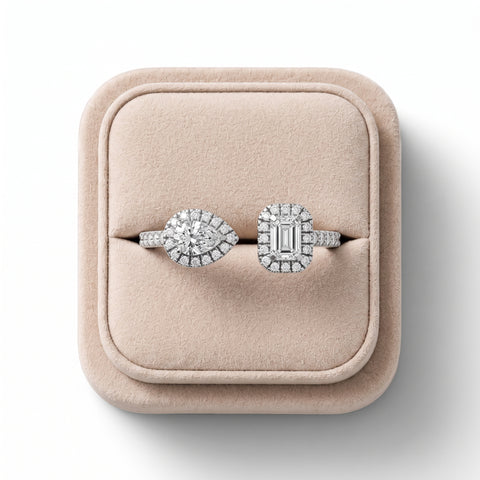 0.6 Ct two stone halo lab diamond ring features a pear-shaped and emerald-cut diamond in 18K gold with halo accents.