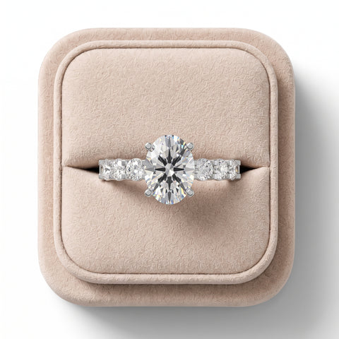 1.99 CT oval lab diamond ring featuring a prominent center stone with tapered side stones, set on a sleek band.