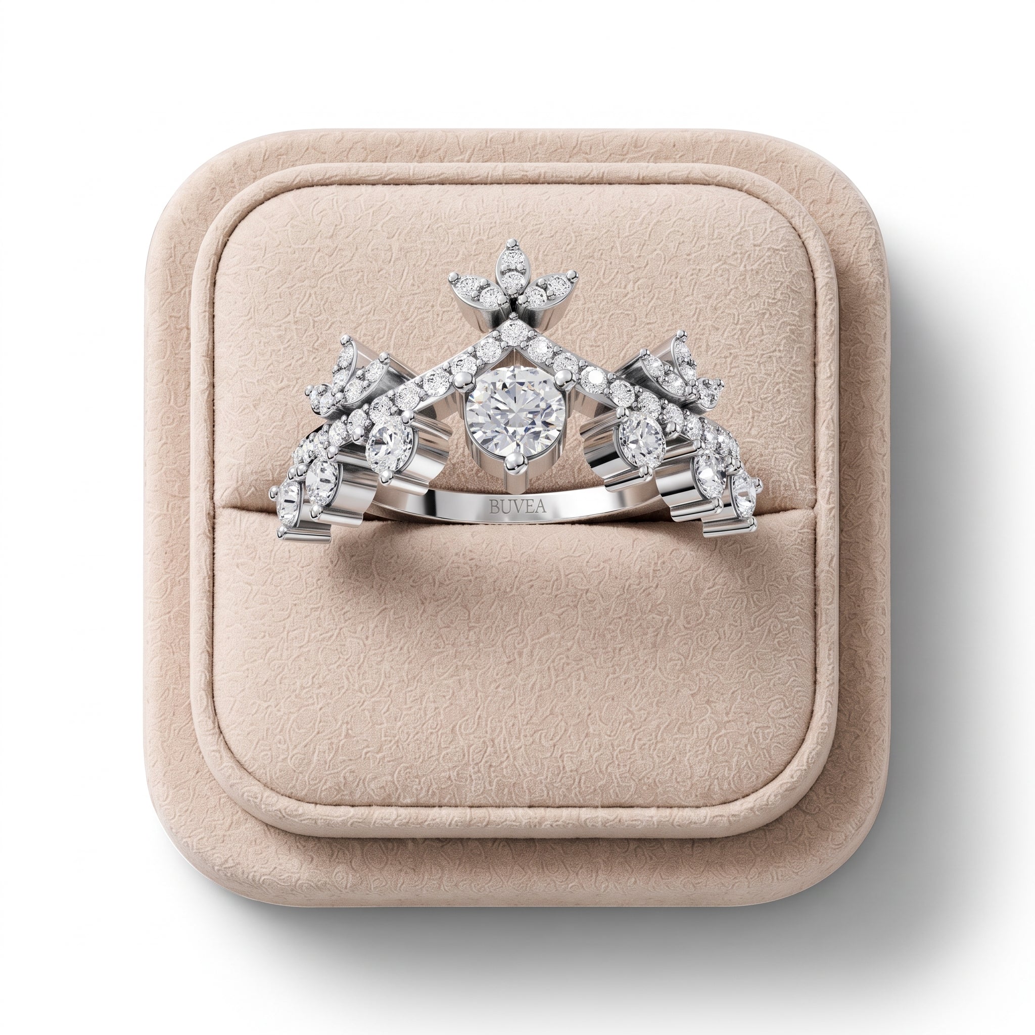Crown-style lab diamond ring featuring a round center stone, surrounded by accent stones in a floral motif. Set in white metal.