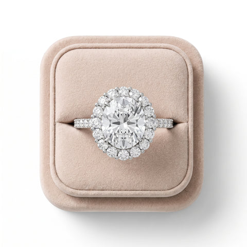 3.28 CT oval halo lab-grown diamond ring with a pavé band, featuring an elevated prong setting and round diamonds in a halo arrangement.