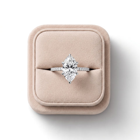 Lab grown diamond ring featuring a 2.5 CT marquise center stone in a six-prong setting; smooth band with hidden halo accents.