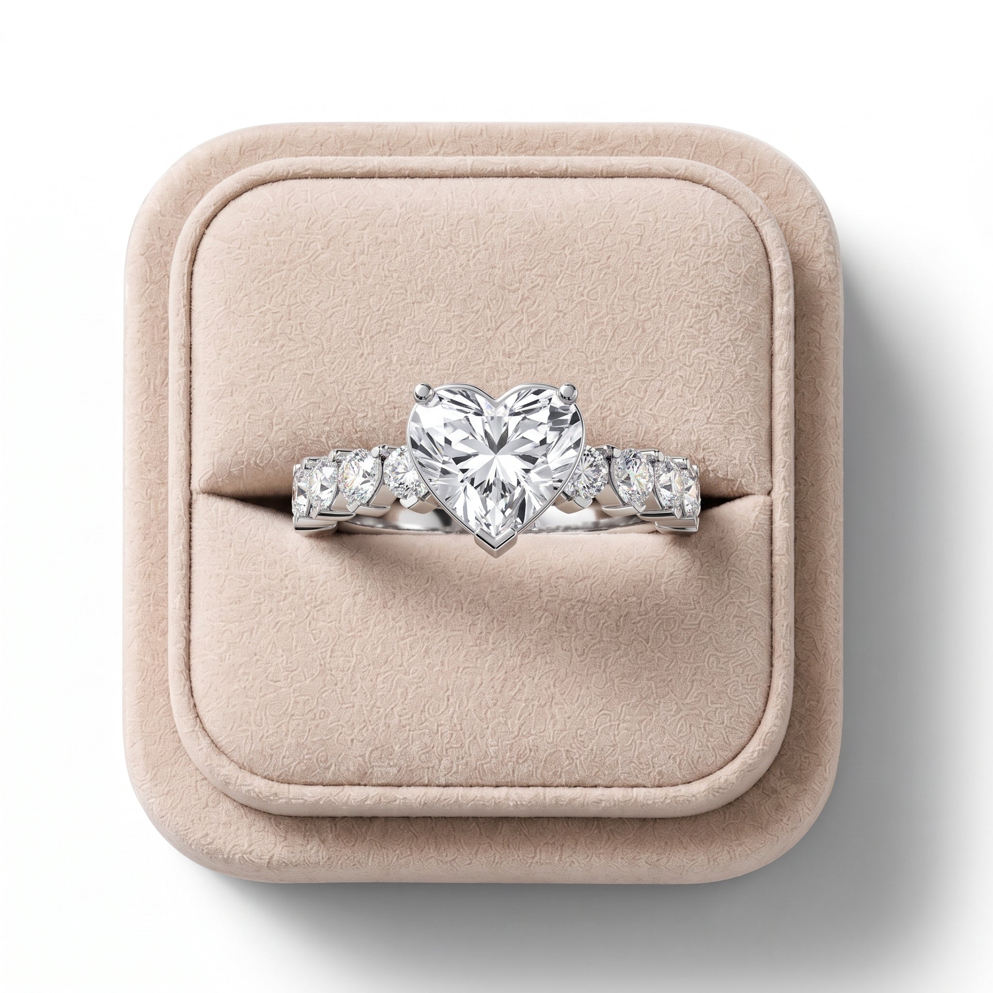 Heart-shaped 3.00 Ct lab-grown diamond ring in white gold with matching heart side stones on a plush display box.