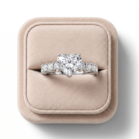 Heart-shaped 3.00 Ct lab-grown diamond ring in white gold with matching heart side stones on a plush display box.