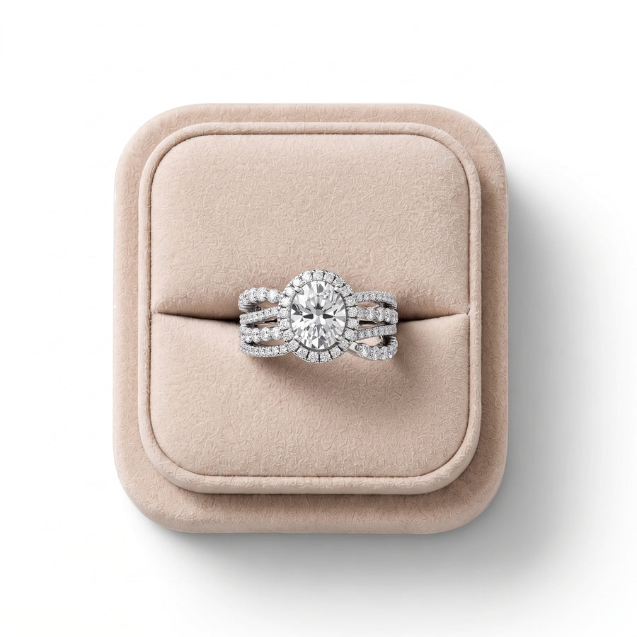 2.28 Ct oval halo lab diamond ring featuring a 1.5 Ct center stone with a split pavé band and round diamond halo.