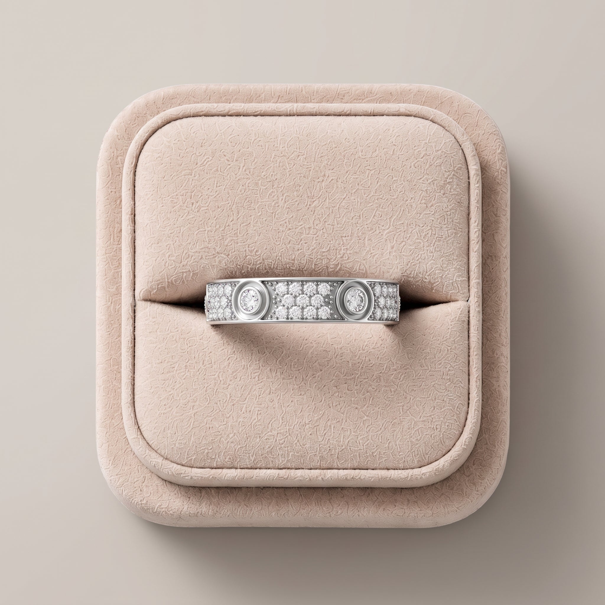 Wide 18K gold band featuring round lab grown diamonds in bezel and pavé settings, presented against a soft pink display.