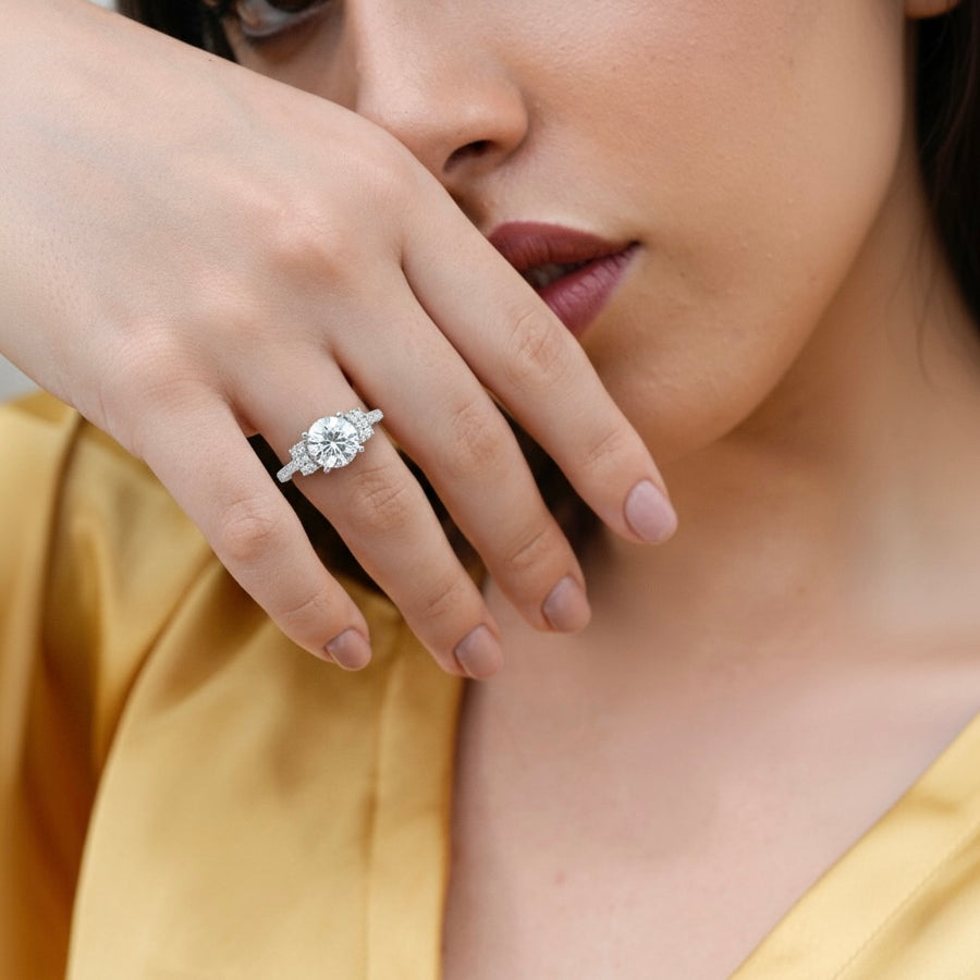 1.80 CT round lab-grown diamond engagement ring worn on hand