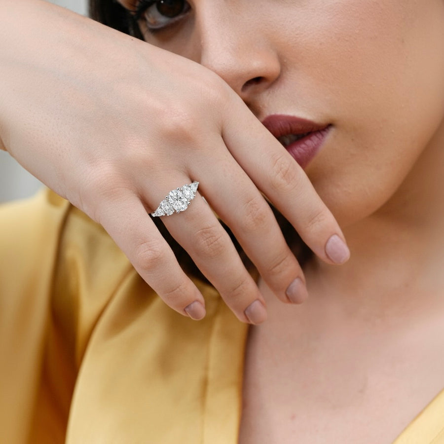 1.28 CT oval five stone lab-grown diamond ring worn on hand