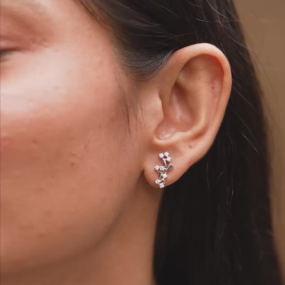0.40 CT lab-grown diamond spiral earrings worn on ears
