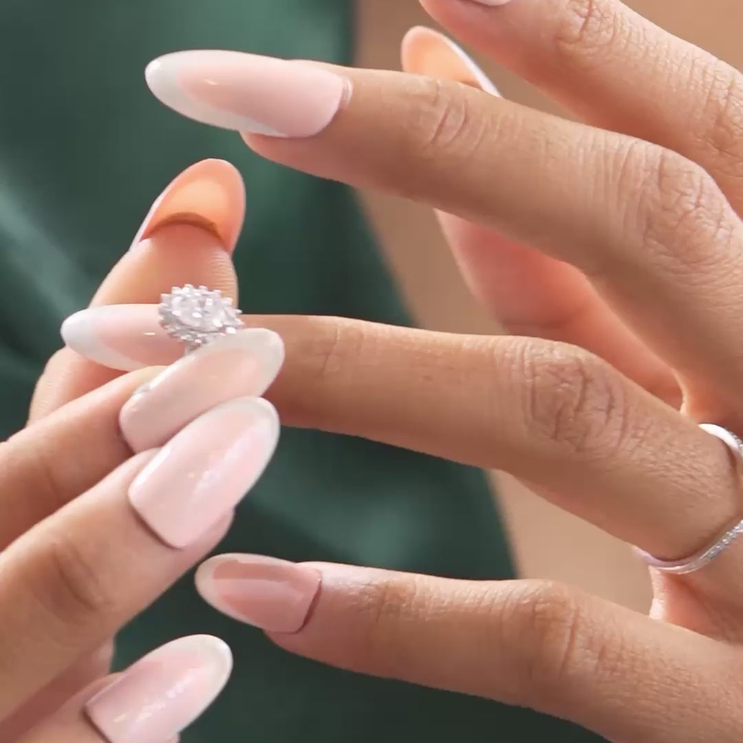 Model wearing 1.03 CT oval lab-grown diamond halo twin ring video clip