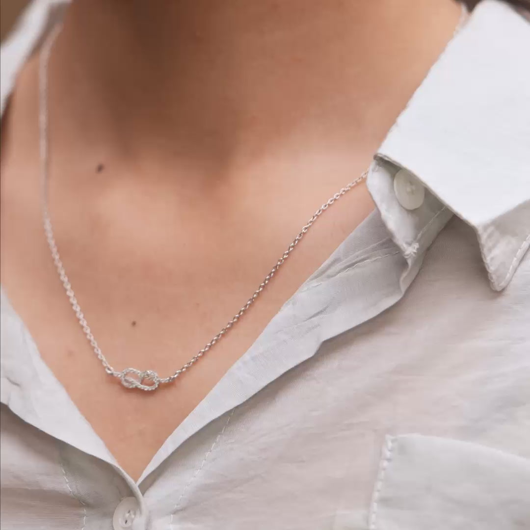 Pendant in motion showing gemstone brilliance on model