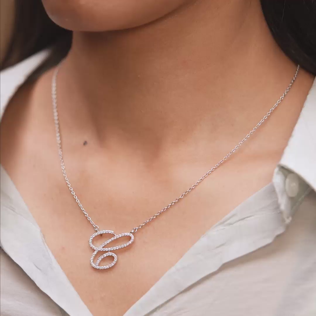 Pendant in motion demonstrating diamond brilliance on model