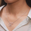 Pendant in motion demonstrating diamond brilliance on model