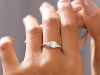 Model wearing marquise accented lab-grown diamond ring video clip
