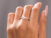 Model wearing round accented lab-grown diamond ring video clip