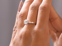 Model wearing round three-stone lab-grown diamond ring video clip