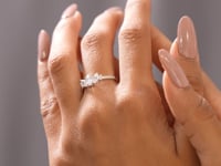 Model wearing 0.84 CT three-stone pear and marquise lab-grown diamond ring video