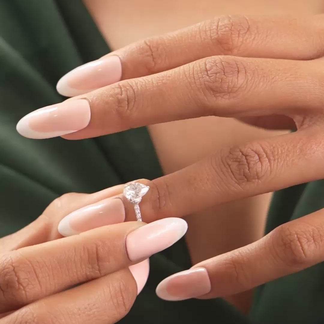 Ring in motion showing continuous brilliance on model's hand