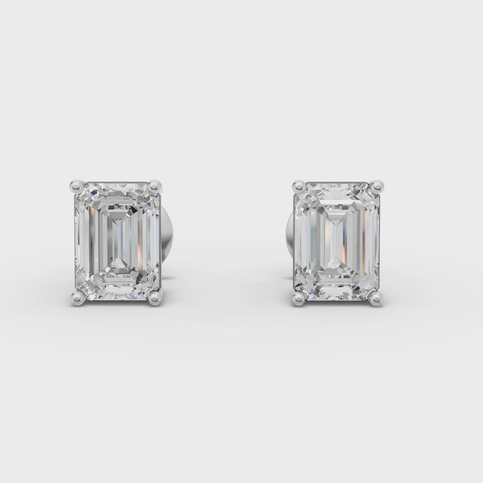 360 rotation of 1.00 CT emerald cut lab-grown diamond stud earrings