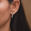 Earrings in motion demonstrating light performance
