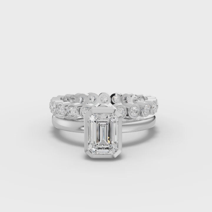 Emerald-Cut Engagement Ring with Bezel Setting and Round Diamond Accents