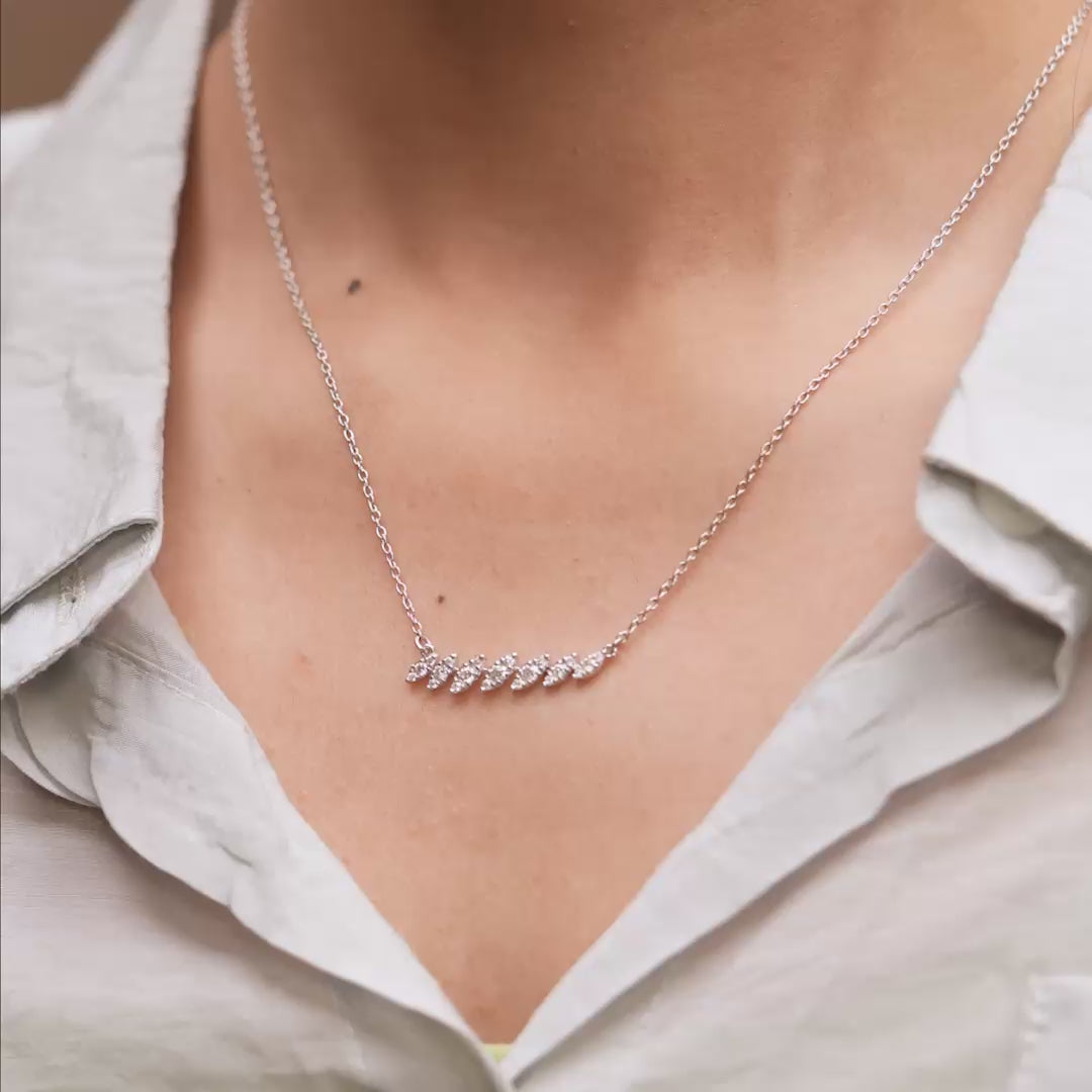 Pendant in motion showcasing brilliance and movement on model