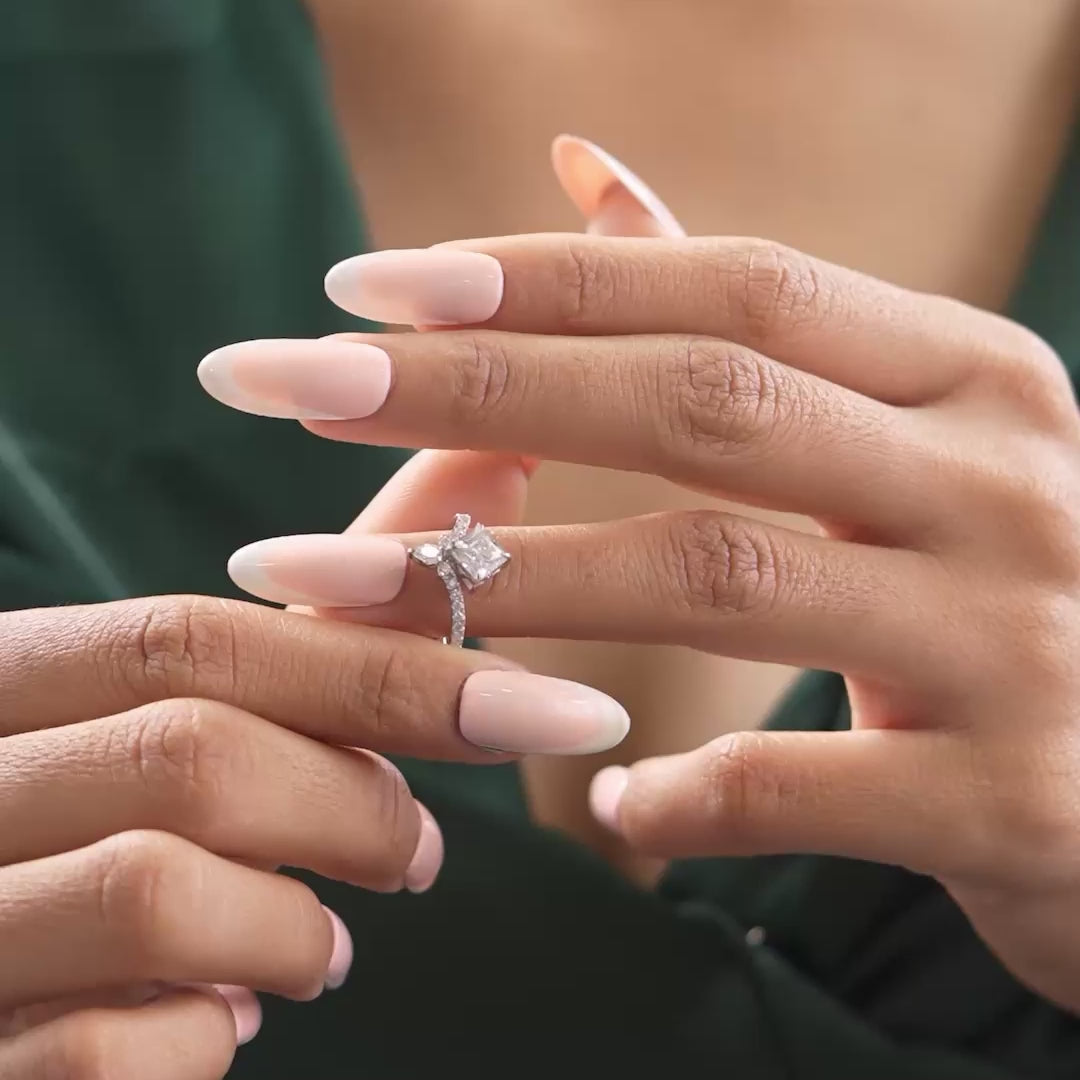 Ring in motion showing pavé brilliance on model's hand