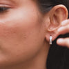 Model wearing 1.35 CT lab-grown diamond channel set huggie earrings video clip
