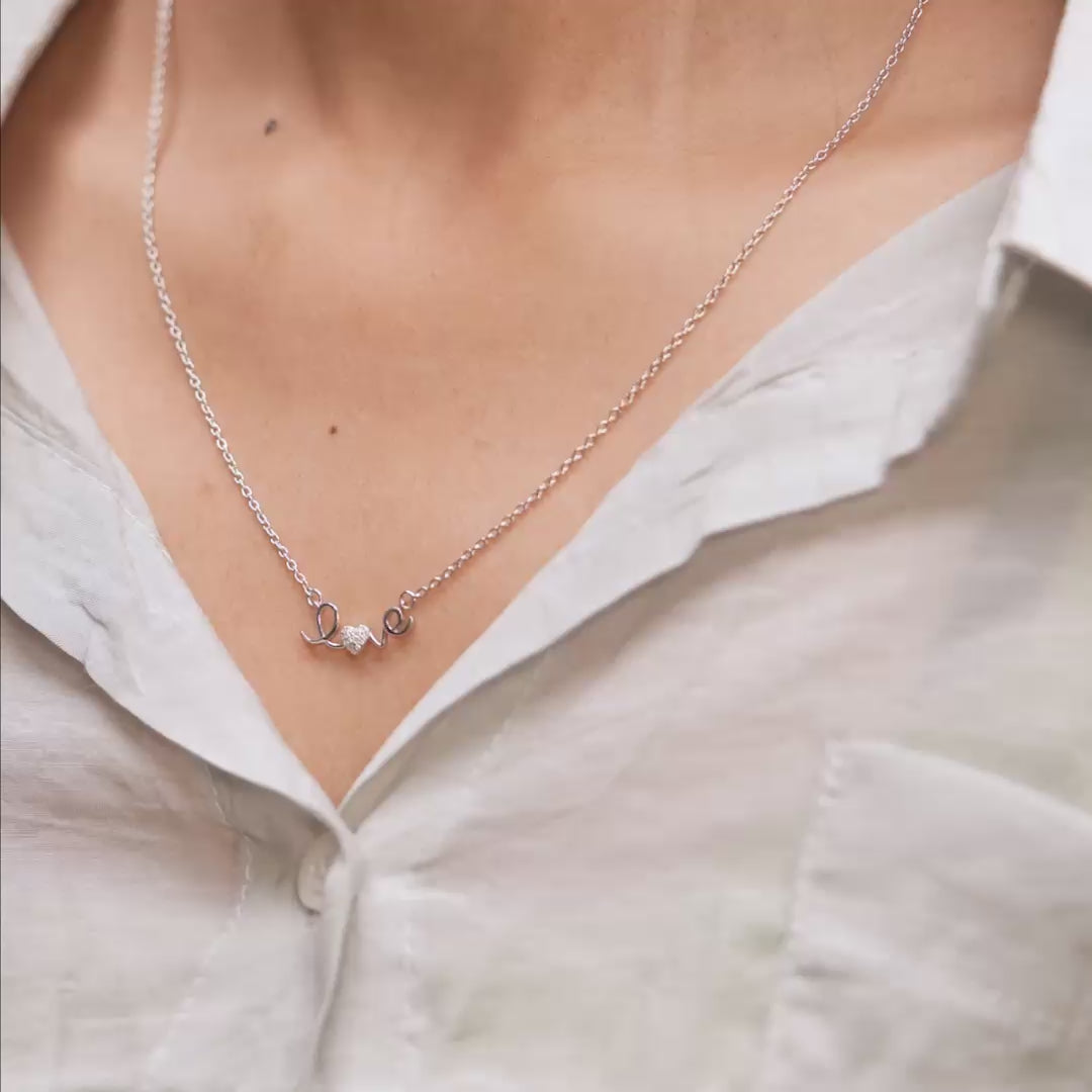 Pendant movement demonstrating reflective lettering on model