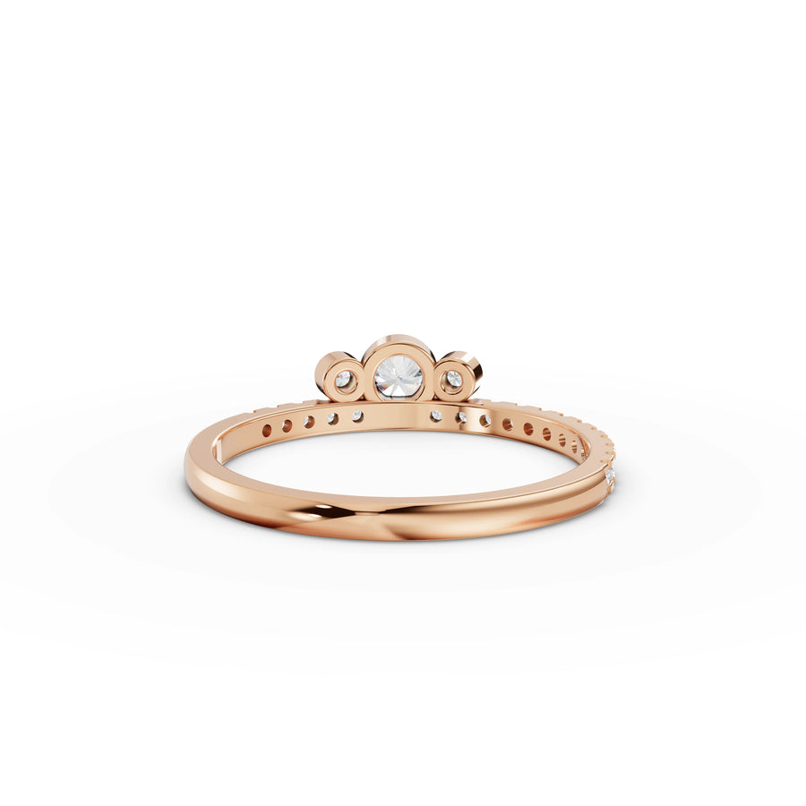 0.29 Ct Round Bezel Three-Stone Ring
