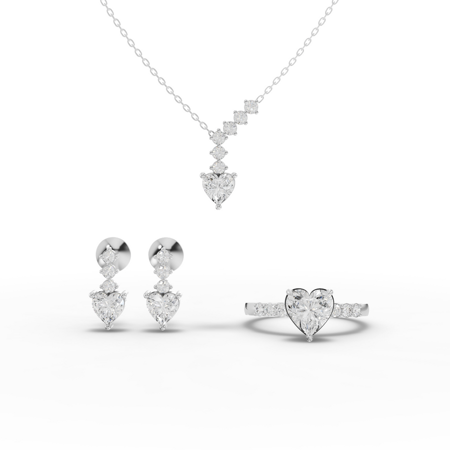 3.08 ct heart-cut graduated lab diamond bridal jewellery set with heart and round diamonds in a refined bridal design