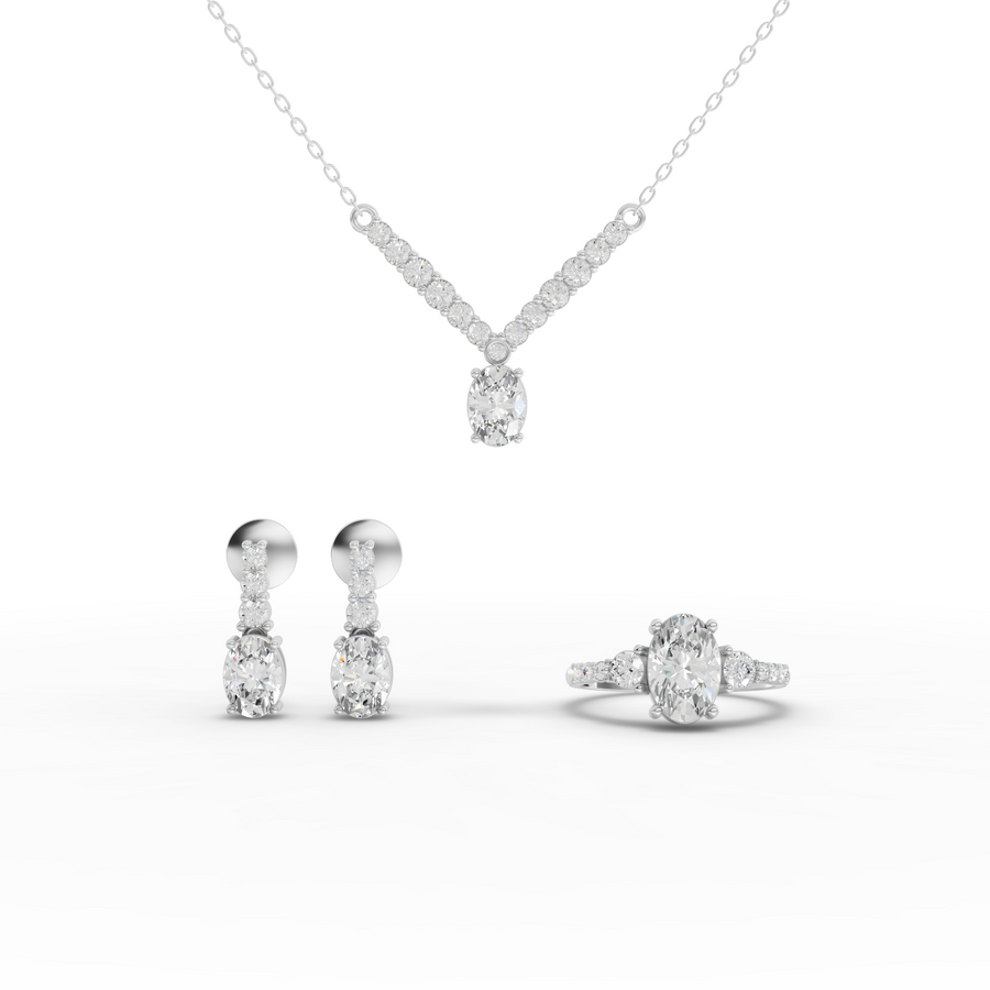 4.54 ct oval lab grown diamond jewellery set with drop necklace, matching earrings, and three-stone pavé ring