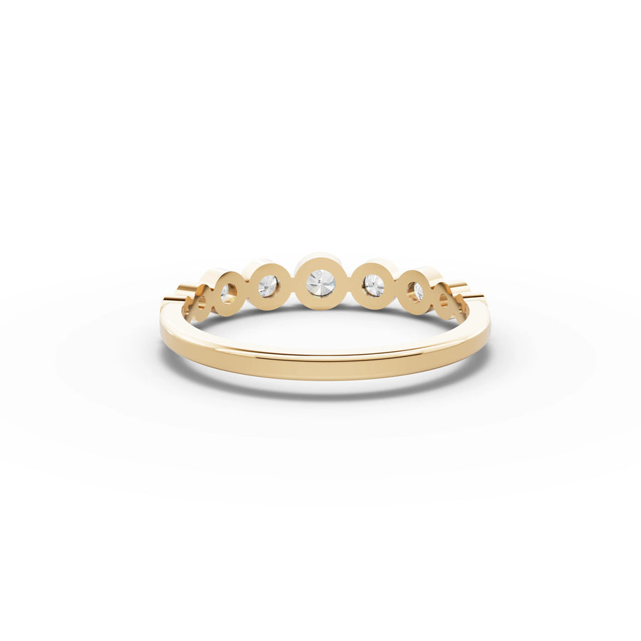 Lab-grown bezel band yellow gold close-up